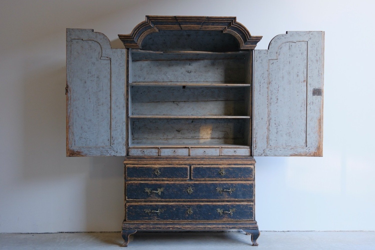 A period rococo cabinet with unusual door panels repainted in black and with a bluish grey interiorior. Original hardware circa 1760 - JAA