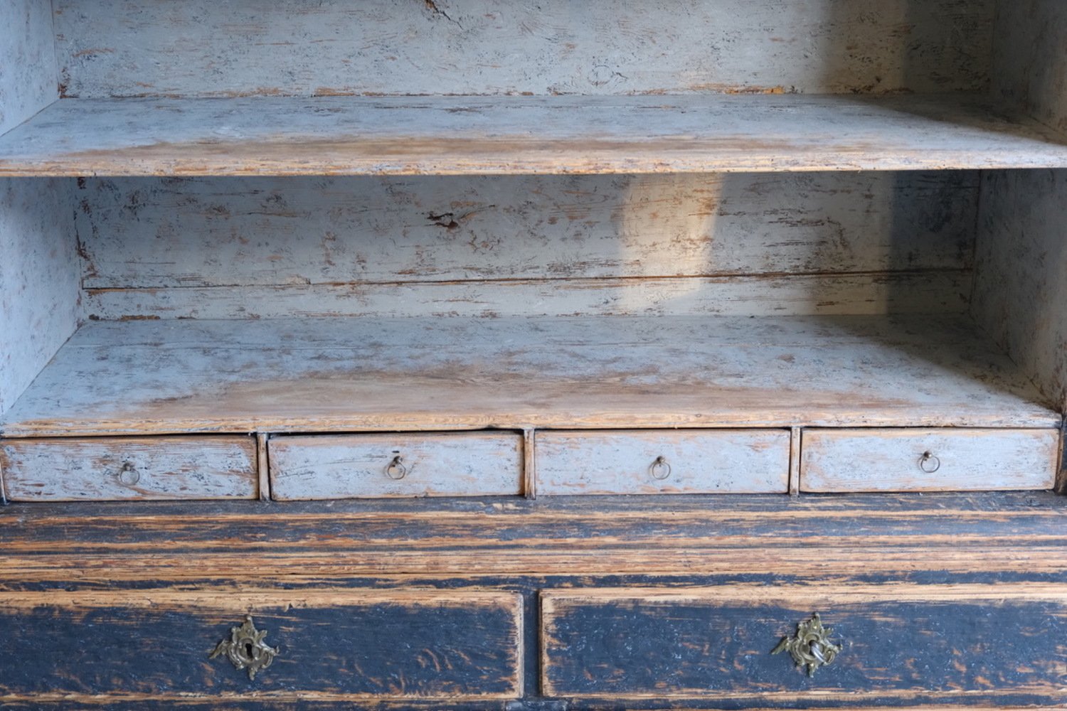 A period rococo cabinet with unusual door panels repainted in black and with a bluish grey interiorior. Original hardware circa 1760 - JAA