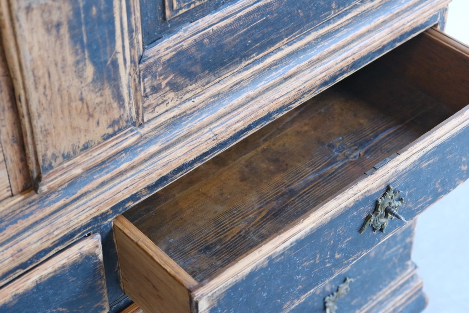 A period rococo cabinet with unusual door panels repainted in black and with a bluish grey interiorior. Original hardware circa 1760 - JAA