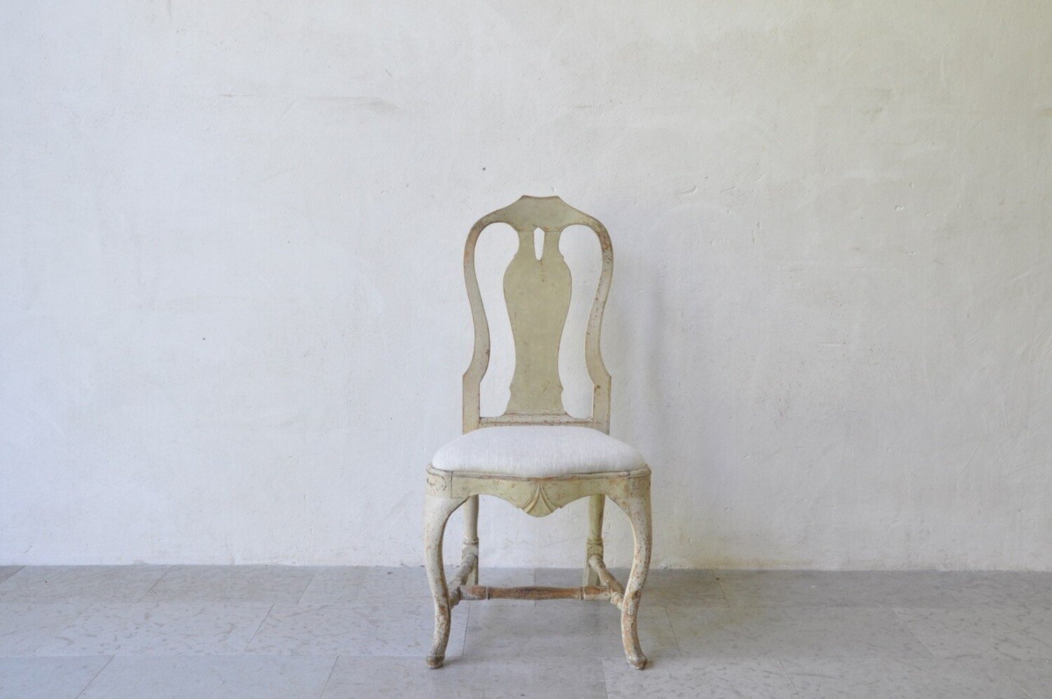 A period rococo chair, scrape to original paint and newly upholstered in linen. Circa 1770 - JAA