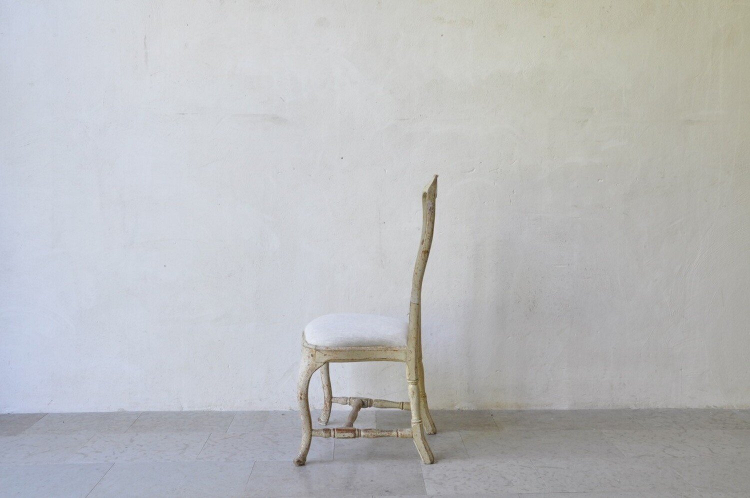 A period rococo chair, scrape to original paint and newly upholstered in linen. Circa 1770 - JAA