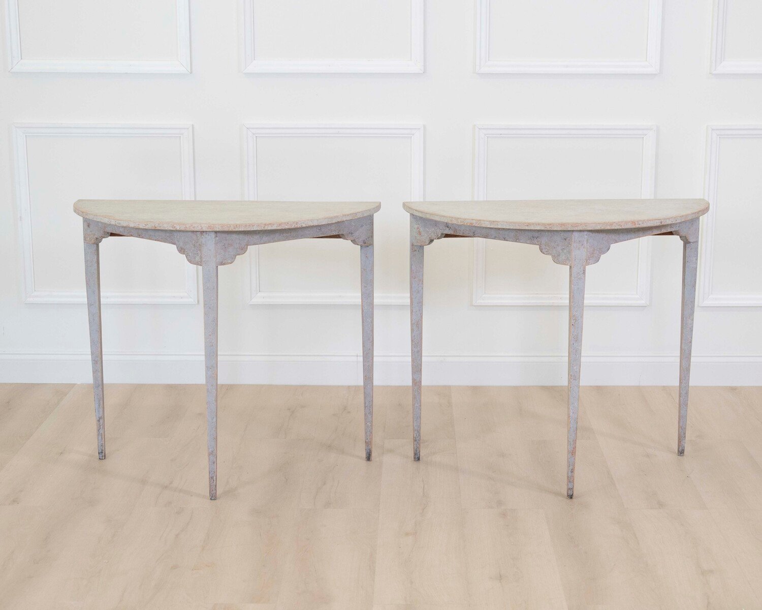 A pair of antique demi lune console tables from Sweden - JAA