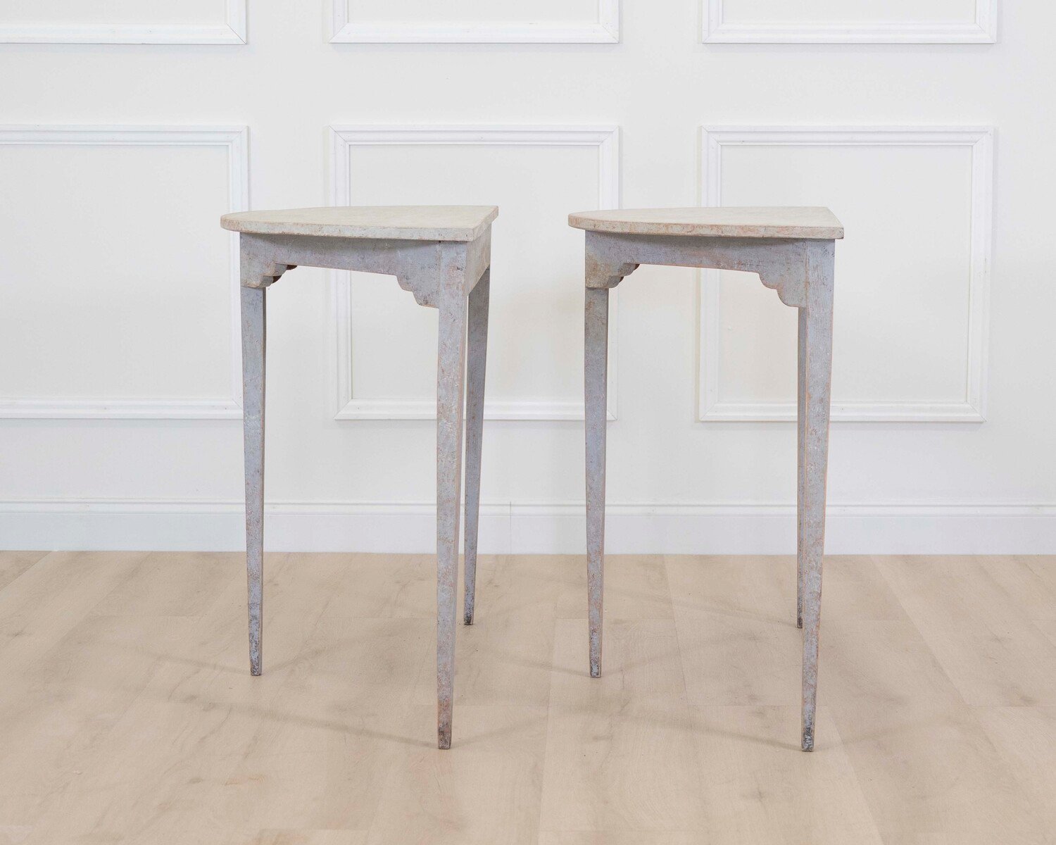 A pair of antique demi lune console tables from Sweden - JAA