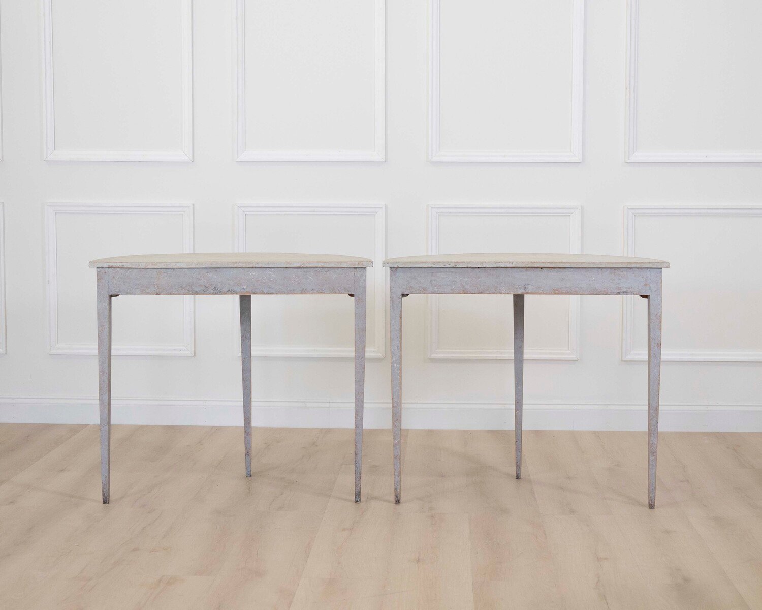 A pair of antique demi lune console tables from Sweden - JAA