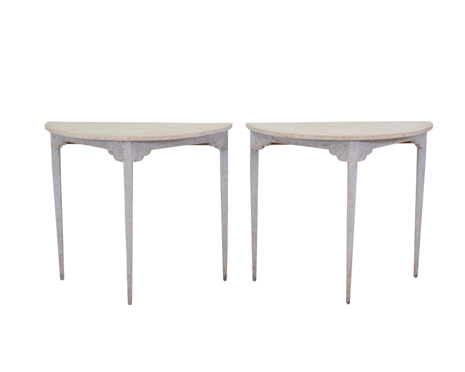 A pair of antique demi lune console tables from Sweden