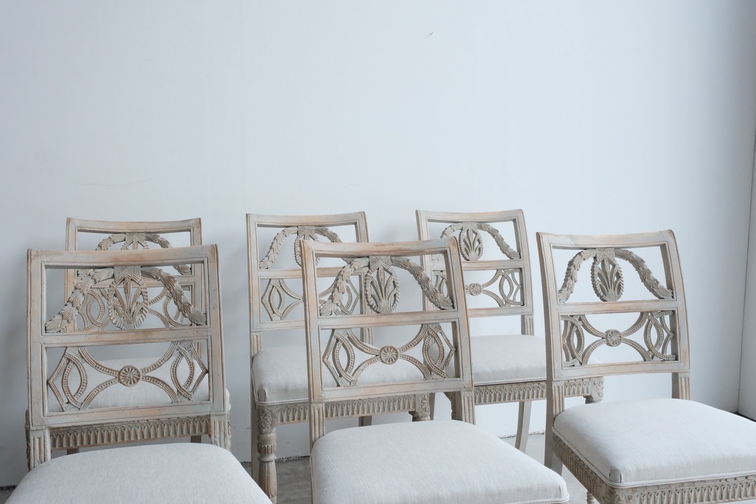 A matched set of 10 unusual period Gustavian chairs, made in Lindome, repainted and newly upholstered in linen - JAA