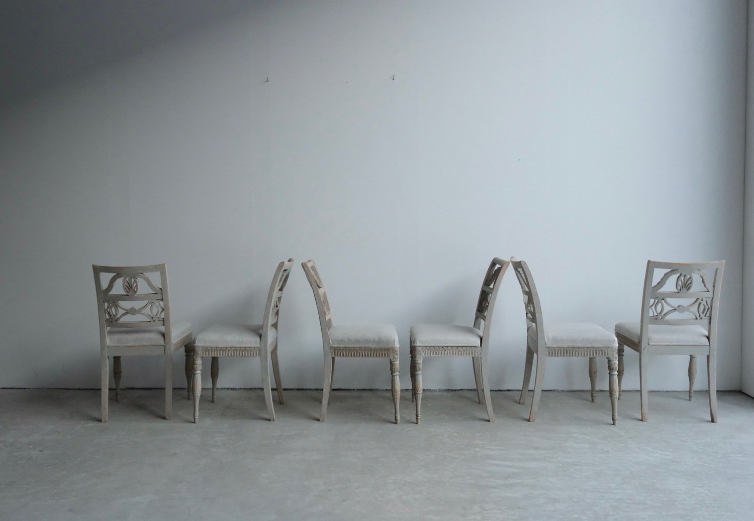 A matched set of 10 unusual period Gustavian chairs, made in Lindome, repainted and newly upholstered in linen - JAA