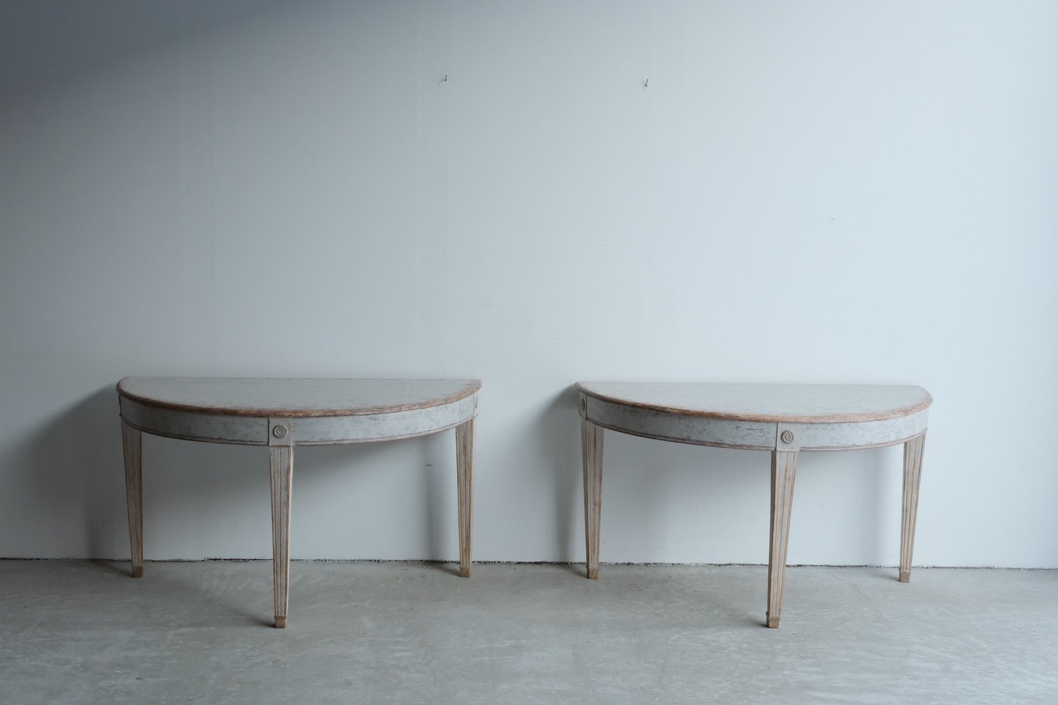 A large pair of mid 19th century Gustavian style demi lune tables, repainted in grey. - JAA