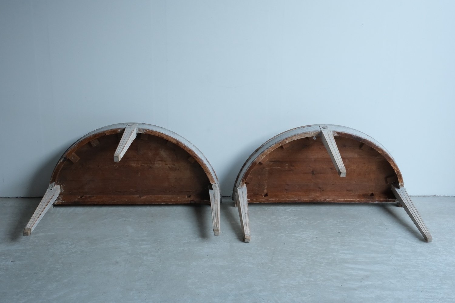 A large pair of mid 19th century Gustavian style demi lune tables, repainted in grey. - JAA