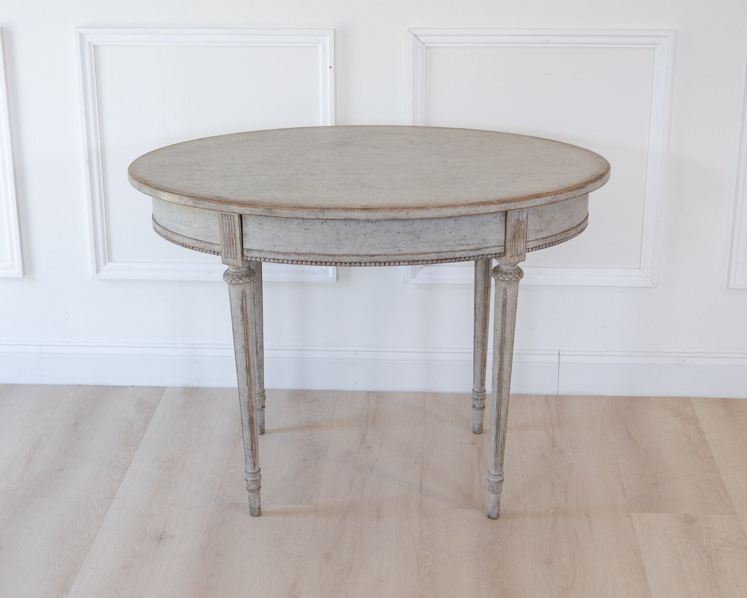 Oval table in the Gustavian style is finished in grey. - JAA
