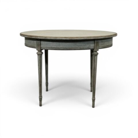 Oval table in the Gustavian style is finished in grey.