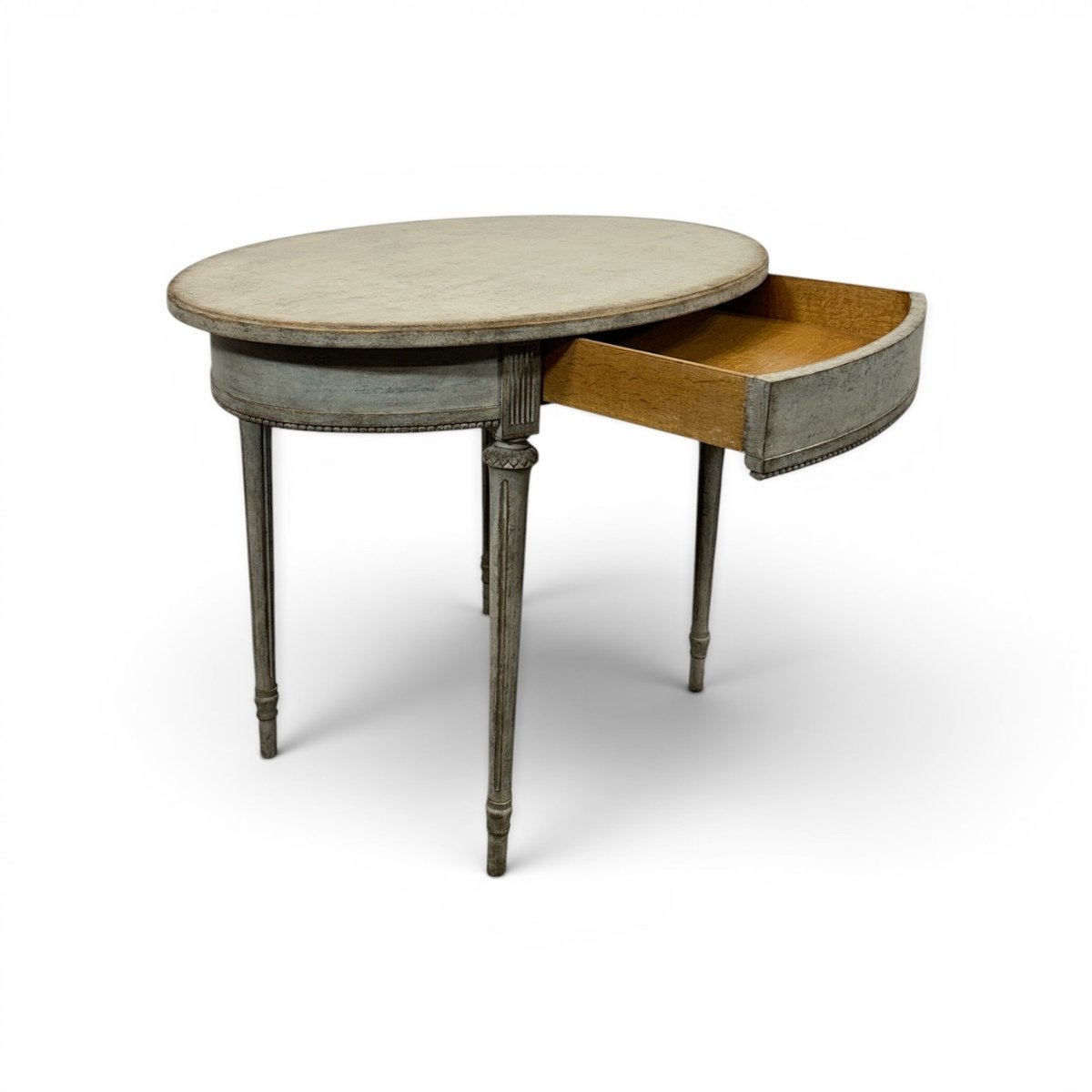 Oval table in the Gustavian style is finished in grey. - JAA
