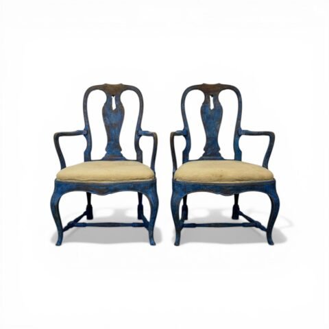 A beautiful pair of antique Swedish Rococo armchairs.