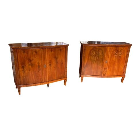 pair from the early 19th century in walnut with a leaf-shaped front.