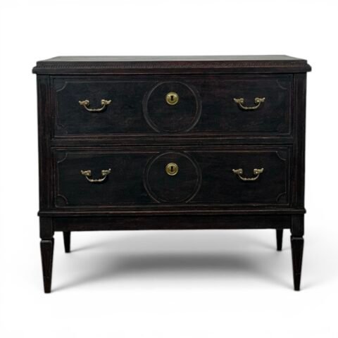 An antique Gustavian-style chest of drawers in black