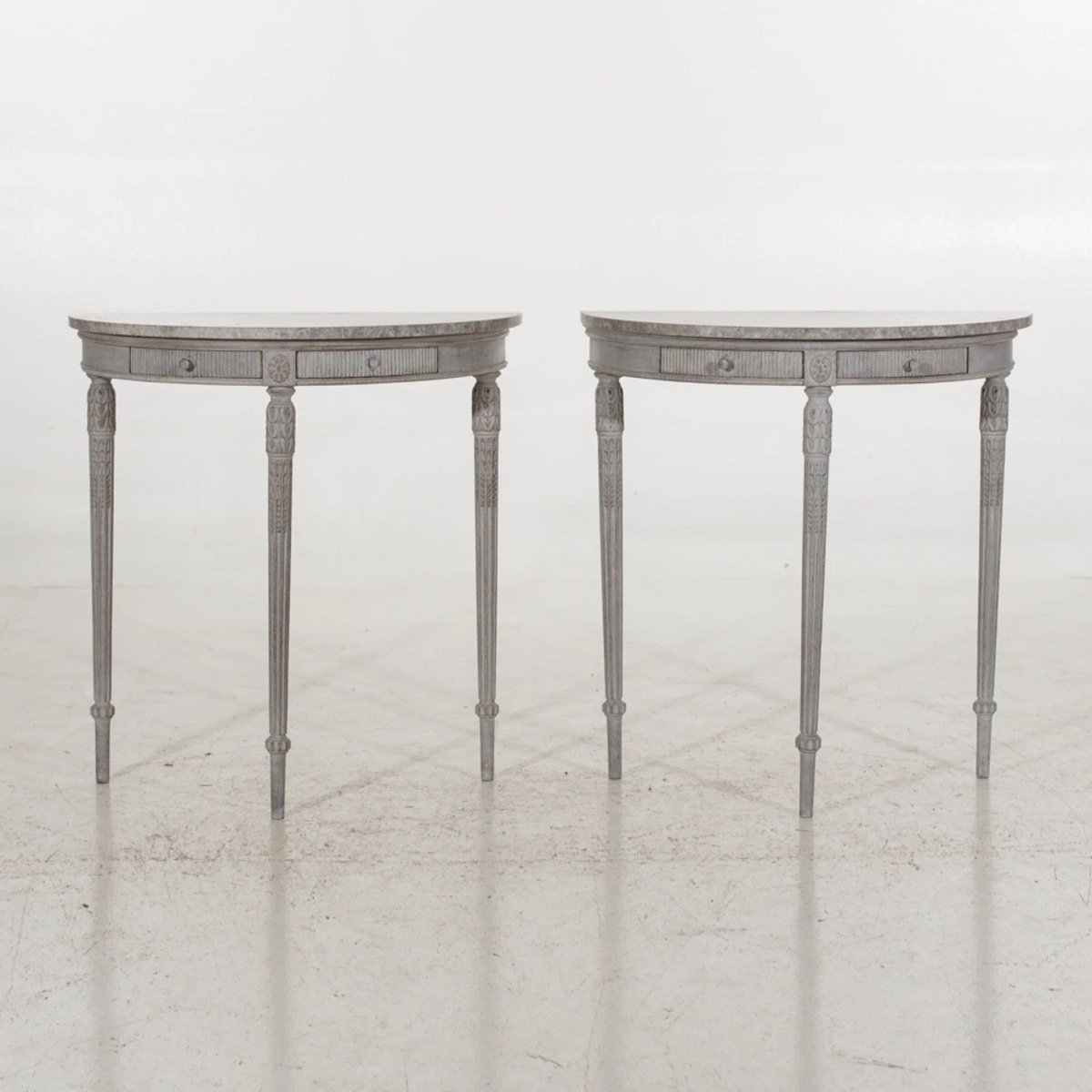 Fine pair of demi-lune tables with beautiful carvings and stone top, circa 19th C. - JAA